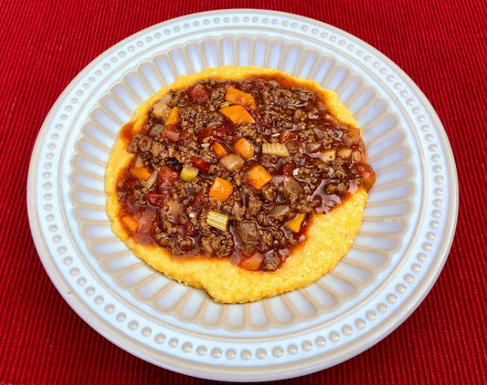 Beef and Veggie Sauce over Cheesy Grits